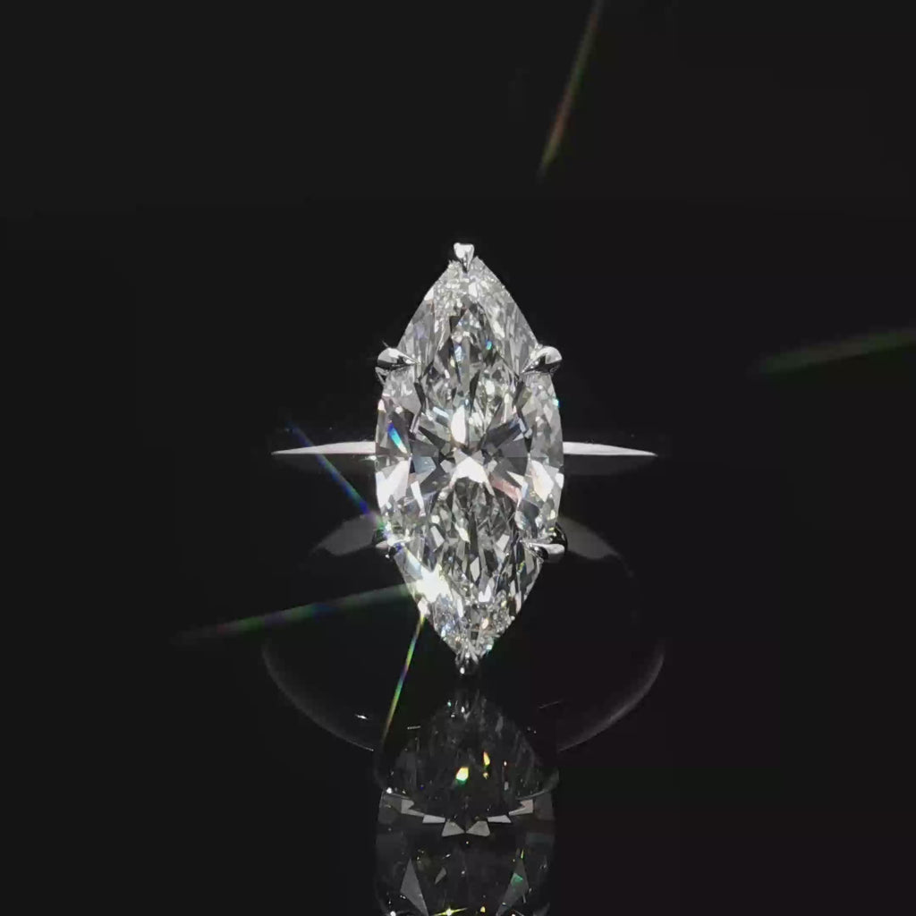 14k White Gold Solitaire Ring with Marquise Cut Diamond